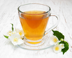 Cup of tea with jasmine flowers