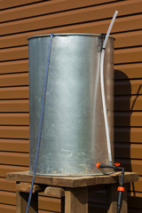 chrome barrel with hoses for irrigation