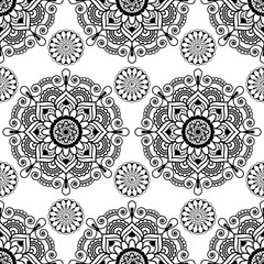 Seamless background with mehndi floral henna lace buta decoration items on white background in Indian style.