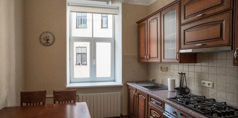 ?itchen with integrated appliances. Wooden design.