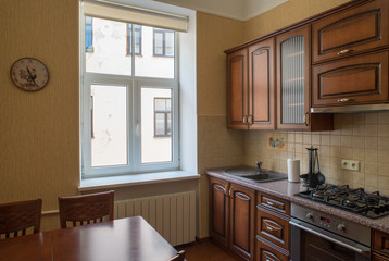 ?itchen with integrated appliances. Wooden design.