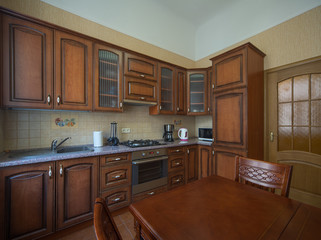 ?itchen with integrated appliances. Wooden design.