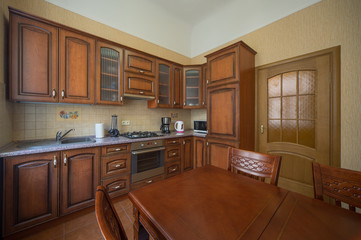 ?itchen with integrated appliances. Wooden design.