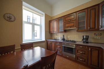 ?itchen with integrated appliances. Wooden design.