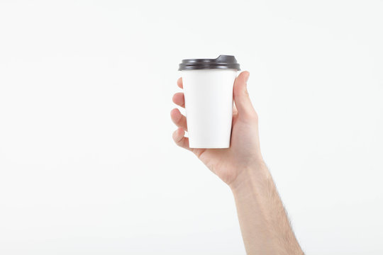 hand holding coffee paper cup