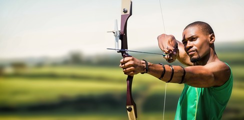 Image of close up view of man practicing archery 