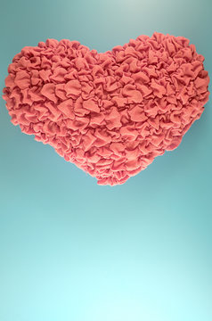 Pink Heart Pillow On Blue Background.