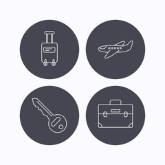 Suitcase on wheels, key and airplane icons.