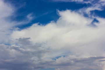 Fluffy white clouds and blue sky.