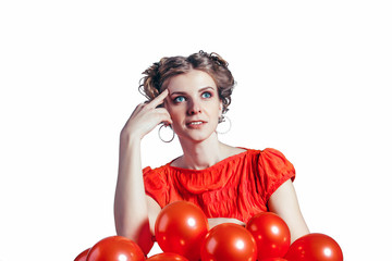 Cute girl has reflected on a white background in  red dress with balloons.