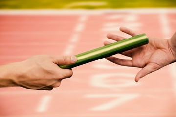 Image of  man passing the baton to partner 