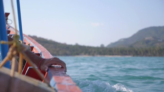 Fisherman Sailing in Boat in Blue Sea. Slow Motion.