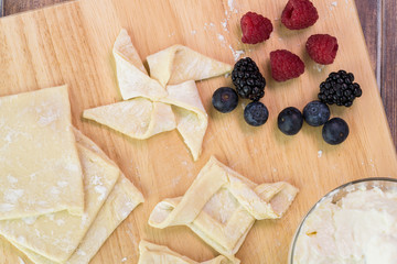 Cut pastry into pinwheel shape and various other shapes.