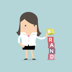 Businesswoman is building Brand cubic box puzzle, vector