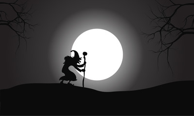 Silhouette of witch and full moon