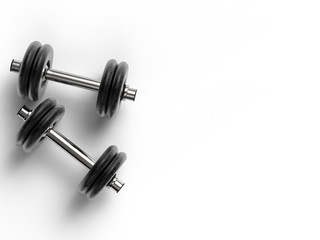 two metal dumbbells on white background