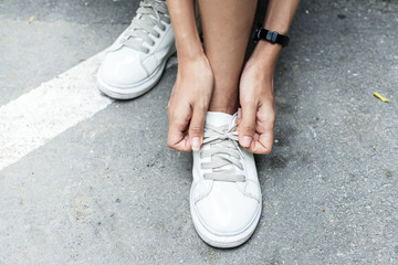 girl shoe laces, Female athlete getting ready for walking 