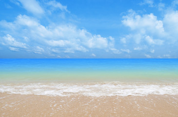 Wave & Sand beach with blue sky background