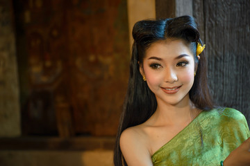 Portrait of beautiful woman wearing in Thai traditional costume