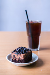 Dark chocolate cake on wood table