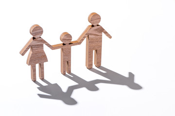 Family figure on wooden background