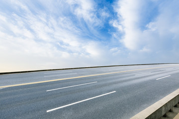 The new asphalt highway is under the blue sky