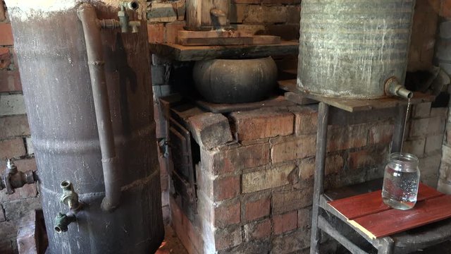 Alcohol process apparatus on fire distillate hooch drink. 4K