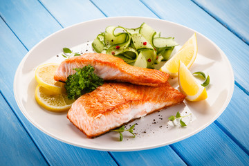 Grilled salmon steaks and vegetables