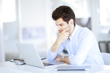 Successful professional man working at office
