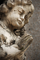 Details of an Old Crumbling Cherub Angel Statue