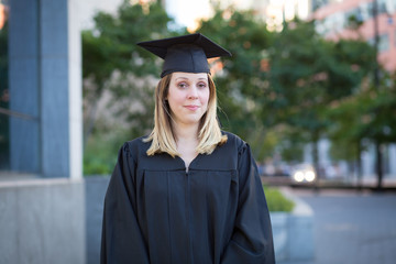Portrait of female college student on campus in graduation day