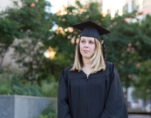 Portrait of female college student on campus in graduation day,