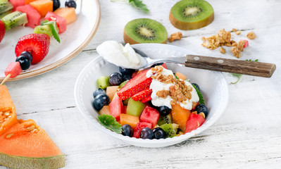 Fresh fruits, muesli and yogurt for breakfast. Healthy eating.