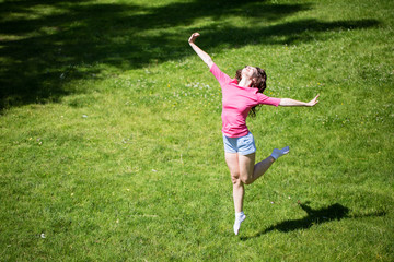 Woman jumping outdoors.