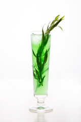 a refreshing cocktail with leaves of tarragon and ice