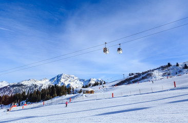 Fototapeta na wymiar View of snow covered Courchevel slope in French Alps. Ski Resort Courchevel