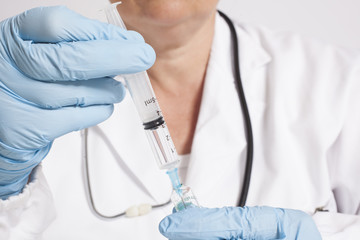 Female doctor with syringe