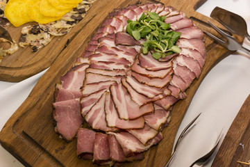 Cheese slices smoked on the table with dinner