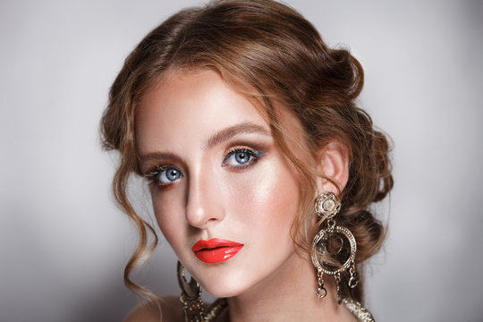 blond hair beauty woman portrait wears golden ear-rings and necklace