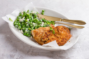 Chicken or pork schnitzel with cheese and  peas salad