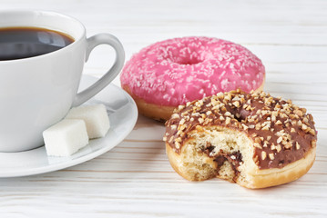 Obraz na płótnie Canvas Donuts and cup of coffee