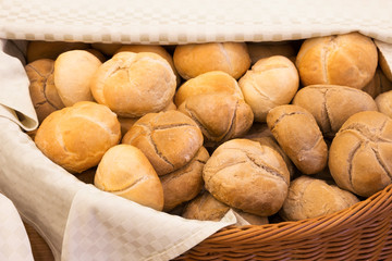 Wicker basket lined with a cloth filled with buns