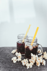 misted bottles of Cola with ice and fresh kettle corn