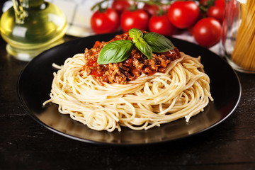 Spaghetti bolognese on dark background