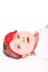 Naklejka na ściany i meble Baby girl with red ribbon.