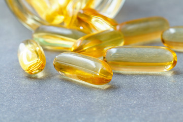 Close up capsules fish oil in Glass bottle .The supplement high