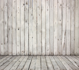 White brick wall and wood floor.