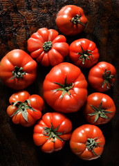 Sicilian tomatoes on a dark wooden background