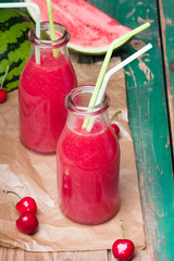 Fresh watermelon juice on a wooden background