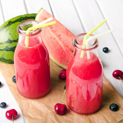 Fresh watermelon juice on a wooden background